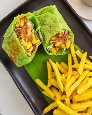 Broritos - Mexican Bean, Coleslaw, Scrambled Tofu, Sweet Corn and Sour Cream in Tortilla Wrap. at Sauce Tree Kuta in Kuta