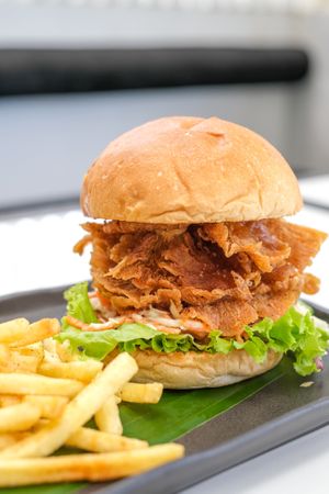 Shroomy Burger - Crispy Mushroom, Coleslaw, Lettuce with Sweet and Sour Sauce and Mayo. at Sauce Tree Kuta in Kuta