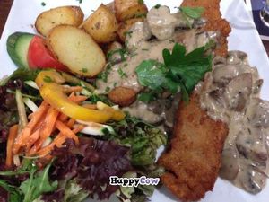 Seitan-Schnitzel ('Hunter Style') with roasted potatoes and salad at Ecco in Cologne