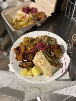clockwise from the bottom: pineapple chow, plantains, BBQ chick-un and mac and cheese, channa, pumpkin, and stewed soya, dhal puri. Spicy slaw in the middle    at ShadoBeni in Pittsburgh