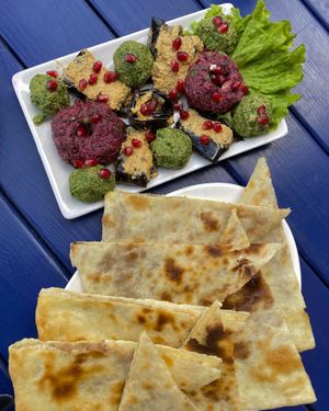 Lobiani and the spread platter with eggplant with walnuts   at Nektari in Tskaltubo