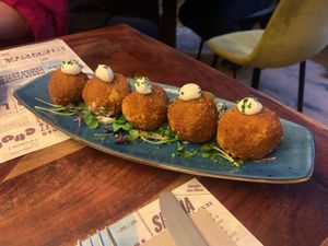 Croquetones de cocido at Distrito Vegano Invernadero in Madrid
