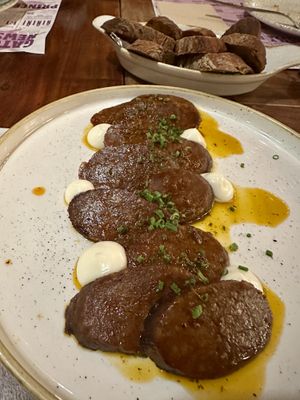 Chorizo in cava sauce   at Distrito Vegano Invernadero in Madrid