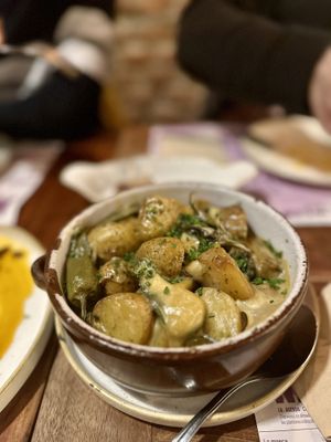 Patatas with cabrales ‘cheese'  at Distrito Vegano Invernadero in Madrid