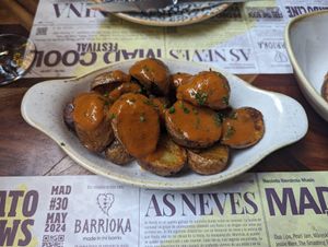 Patatas bravas at Distrito Vegano Invernadero in Madrid