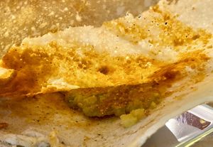 Mulakapodi Masala Dosa inside  at Saravanaa Bhavan in Rome