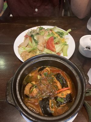 Tofu with seaweed and pineapple in claypot, and soy chicken noodles at the back   at Tinh Tam Vegan in Hue