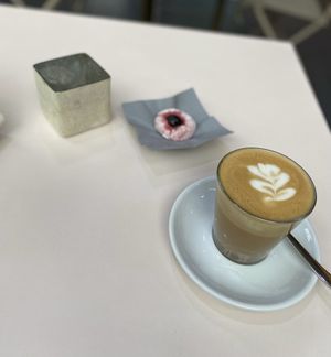 Oat milk flat white with almond thing  at moxxa.caffè in Cologne