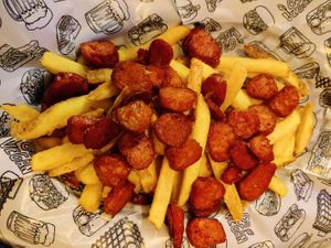 Fries with chorizo and chimichurri at La Loncheria Bcn in Barcelona