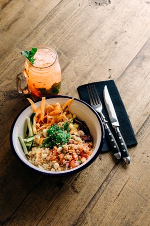 Hawaiian poke bowl with Plant-Based “Tuna”, integral rise, pineapple, beetroot, peanuts, carrot, cucumber, red cabbage, wakame seaweed, avocado, “Pico De Gallo” sauce and s at La Loncheria Bcn in Barcelona