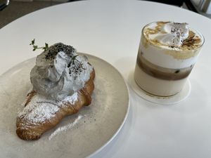 Black sesame croissant & almond latte  at Nuldam Space - 널담은공간 경복궁점 in Seoul