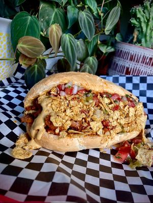 Nacho Sammy Special: Queso whiz, chipotle seitan, fresh pico de gallo, crushed noochy tortilla chips. at Sammies in Bellingham