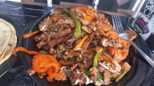 Huge mix meat dish with cheese and capsicum absolutely delicious and gluten free at V De Vegano  in Mexico City