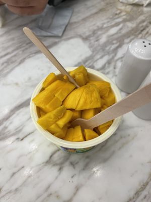 Mango ice cream with extra mango  at MyGovindas - JLT in Dubai