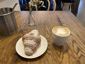 Pistachio croissant with an oat flat white!  at FREA Bakery in Berlin