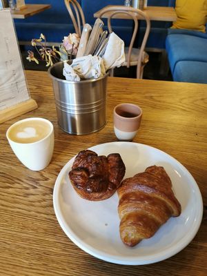 Cappuccino, cardamom croissant and a normal croissant. The cardamom croissant is amazing!! at FREA Bakery in Berlin
