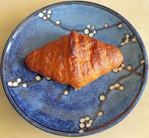 Plain croissant taken home at FREA Bakery in Berlin