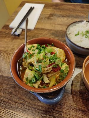 Tofu chunks in a tomato and garlic stock at The Real Wan in Glasgow