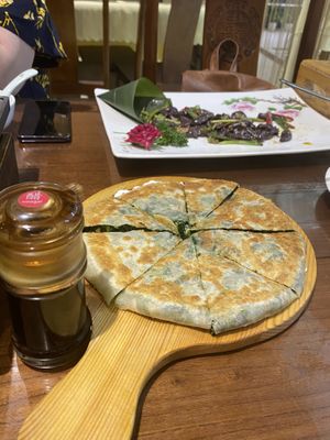 A “pie” with chinese spinach and mushrooms  at Fu Hui Ci Yuan Vegetarian Restaurant in Beijing