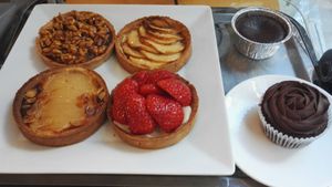 Perigord walnuts tart, Apple tart, Bourdaloue tart (almond cream and pear), Perigord strawberries tart, chocolat fondant and chocolate ganache muffin at Avec&Sans in Perigueux