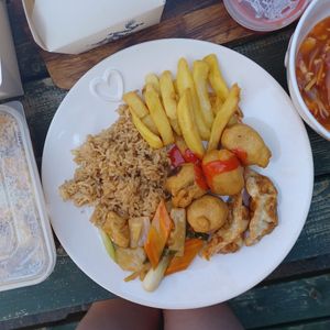 Fried rice, chips, sweet n sour chicken, dumplings and water chestnuts with tofu and bamboo shoots at Vegan House in Pudsey