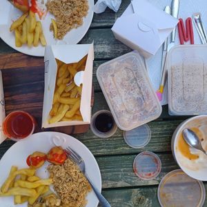 Fried rice, chips, sweet n sour chicken, dumplings and water chestnuts with tofu and bamboo shoots at Vegan House in Pudsey