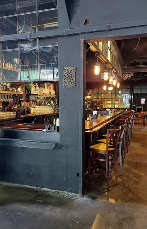Large dark elegant bar at Alloy Kitchen in Bellefonte