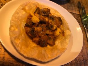Garlic mushrooms on puri starter   at Cafe Spice in Newcastle Upon Tyne