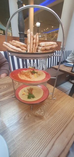 Cold meze (top to bottom): GREEK FLATBREAD, HOUMOUS, SANTORINI FAVA at The Real Greek in Manchester