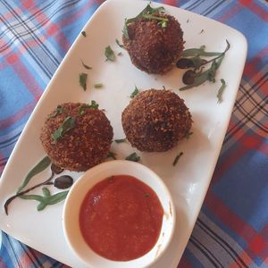 Pomballen with homemade spicy tomato sauce at The Old Soul in Amsterdam