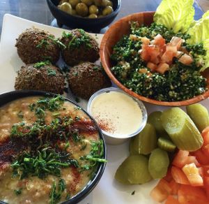 Falafel tabouli and fuul with a side of olives at Kareem's in Anaheim