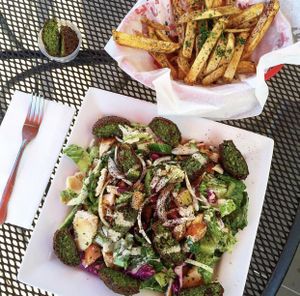 Falafel salad with a side of fries and extra Falafel at Kareem's in Anaheim