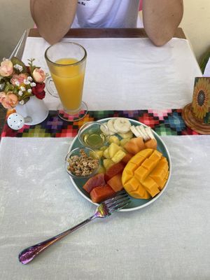 Seasonal fruit plate and orange juice  at La Tradición in Palenque