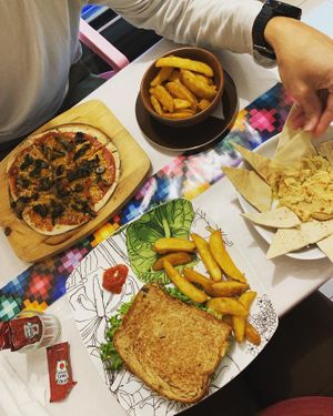 Vegan pizza, potato wedges, hummus & the vegan sandwich   at La Tradición in Palenque