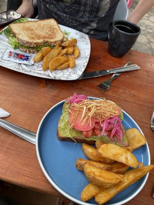Breakfast! Avocado toast and grilled cheese Bread with fruit and coffee  at La Tradición in Palenque