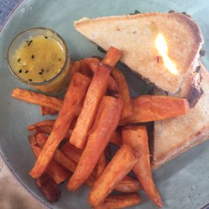 French lentil dhal and cheese toasty with sweet pot fries and mango chutney at The Cardamom Pod in Southport