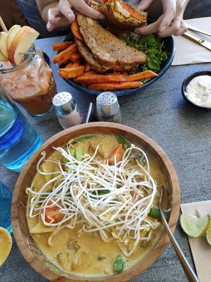 Laksa, toastie with sweet potato chips and a juice at The Cardamom Pod in Southport