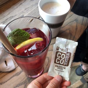 Raspberry iced tea, oat latte, and vegan truffle  at Espresso House in Helsinki