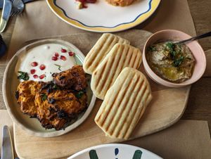 Sweet potato pancakes (left), naan bread (middle) and baba ghanoush at Uferlos in Stein Am Rhein