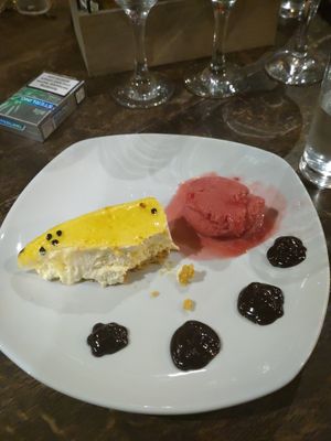 Half eaten vegan passion fruit cheesecake 🤤 at The Anchor Inn in Tideswell