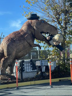 Dino eating Putin   at Hangry Planet in San Bruno