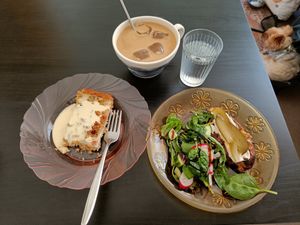 Rhubarb pie, a potato pie with a lil' salad, and an iced latte. Everything tastes way better than their looks! 🍰 at Kahvila Rakastan in Helsinki