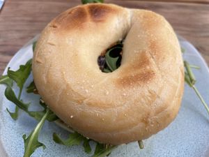 Hommus and caramelised onion bagel  at CBCB & ODFUB in Brunswick