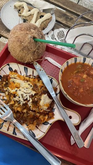 Lasagna, mediterranean soup, a blueberry scone & coconut water.   at Sopitas in San Jose
