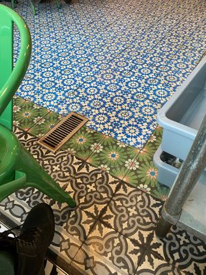 Colorful patterned tiles in the indoor dining area  at Little Rico in Hudson