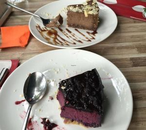 desserts... raw chocolate cake (the back one) is the best! at Cafe SOK in Moscow