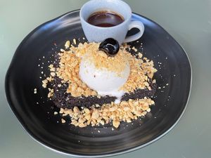 Brownie covered with peanuts, soft serve ice cream, andchocolate sauce at Planta Queen - Fort Lauderdale in Fort Lauderdale