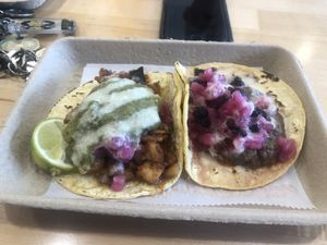 Taco on the left is the ‘papas de tamarindo’, taco on the right is ‘black magic’  at Tacowala in Somerville