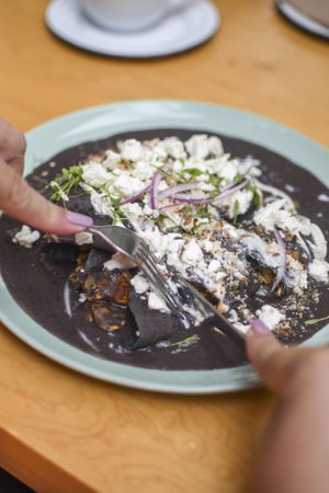 Enfrijoladas with vegan chorizo, almond cottage cheese and vegan cream. Add tofu  at La Otilia - Polanco in Mexico City