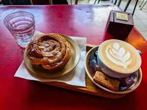Vegan Cinnamon Roll and Cappuccino at Ludo Kafe at LUDO in Ghent